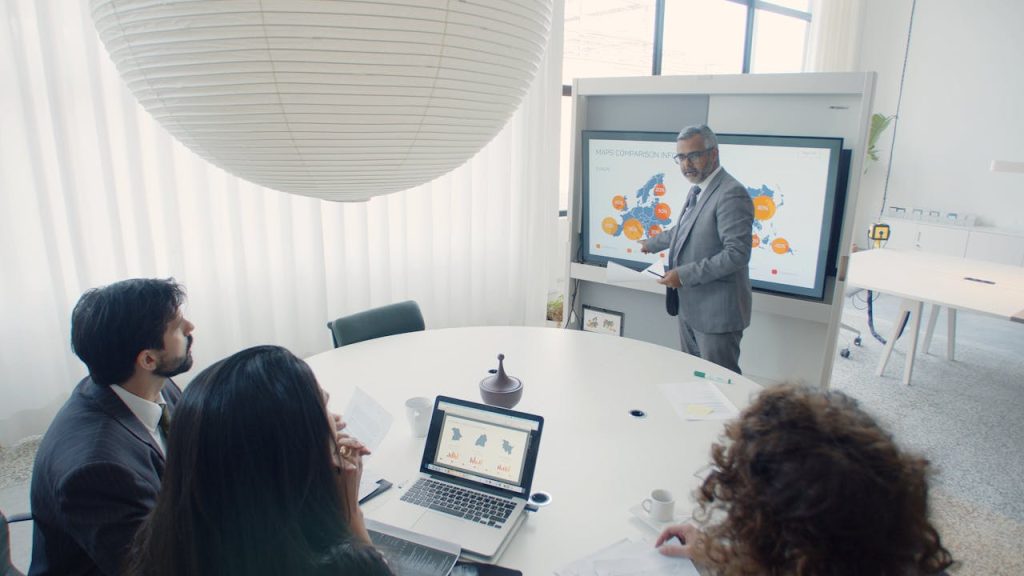 Professional team engaged in a business presentation in a modern office setting